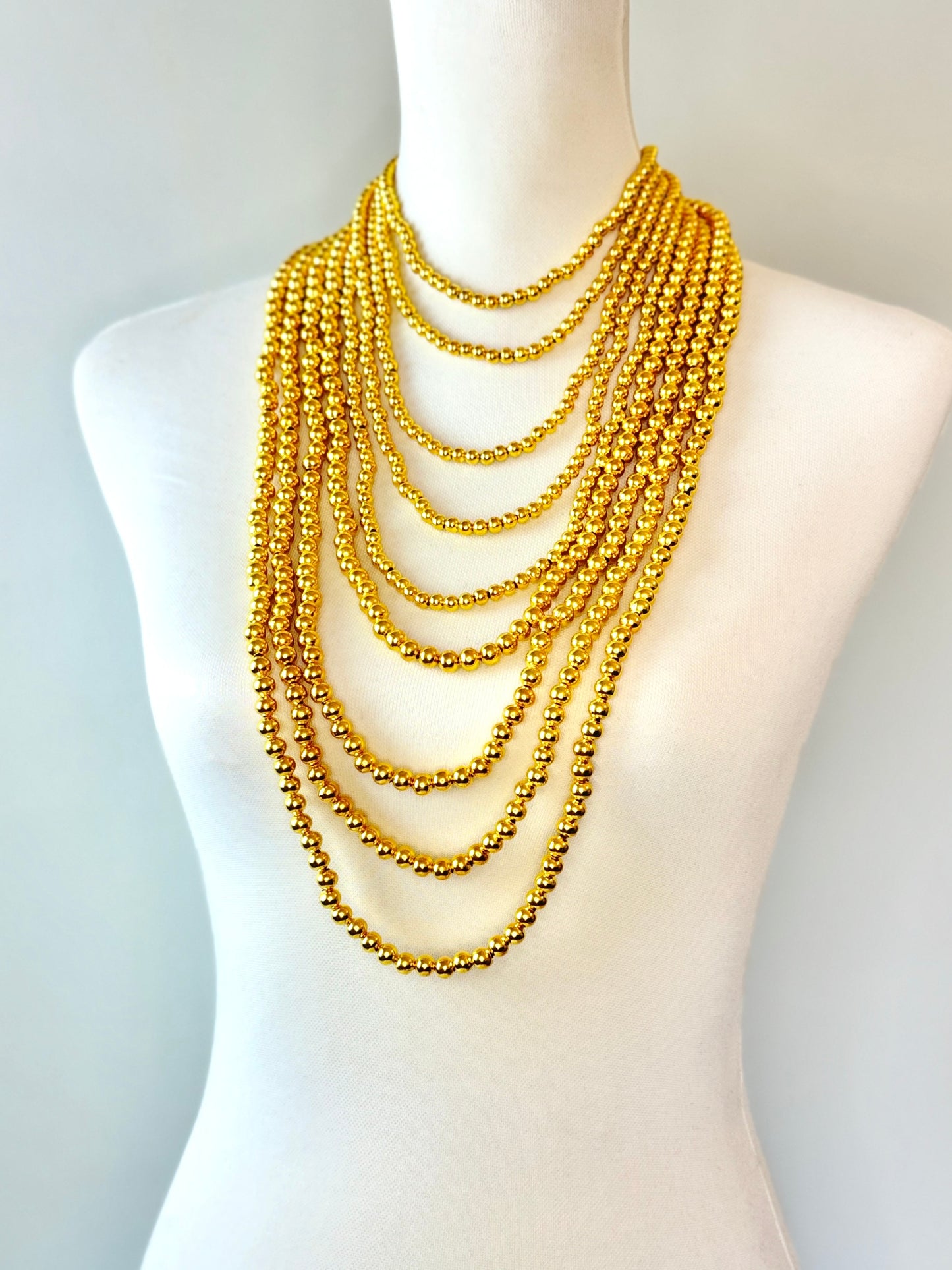 COLLAR CUENTAS DORADAS